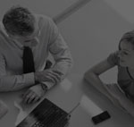 Segment of image of people sitting at a desk