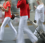 women walking with bags